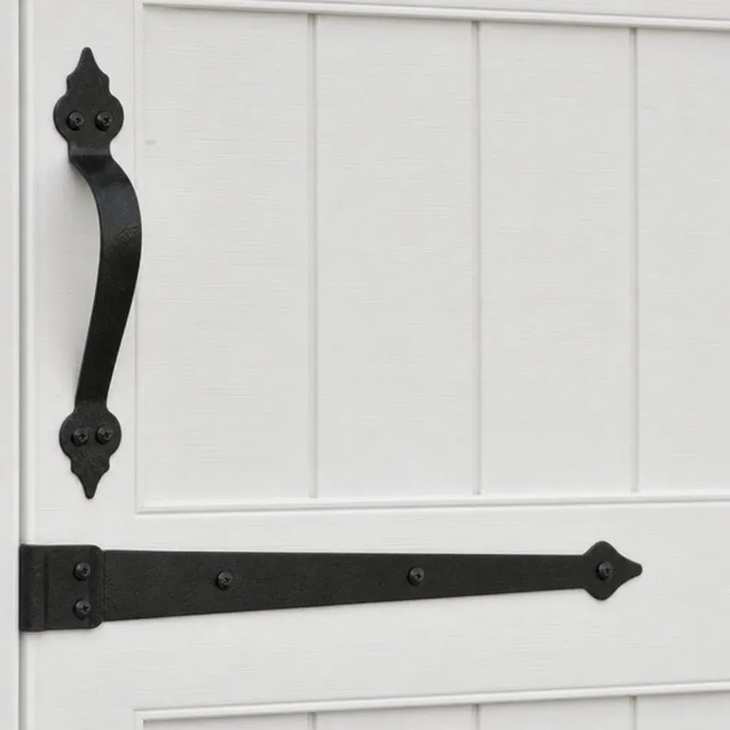 Close up of farmhouse style garage door hardware on a white paneled door