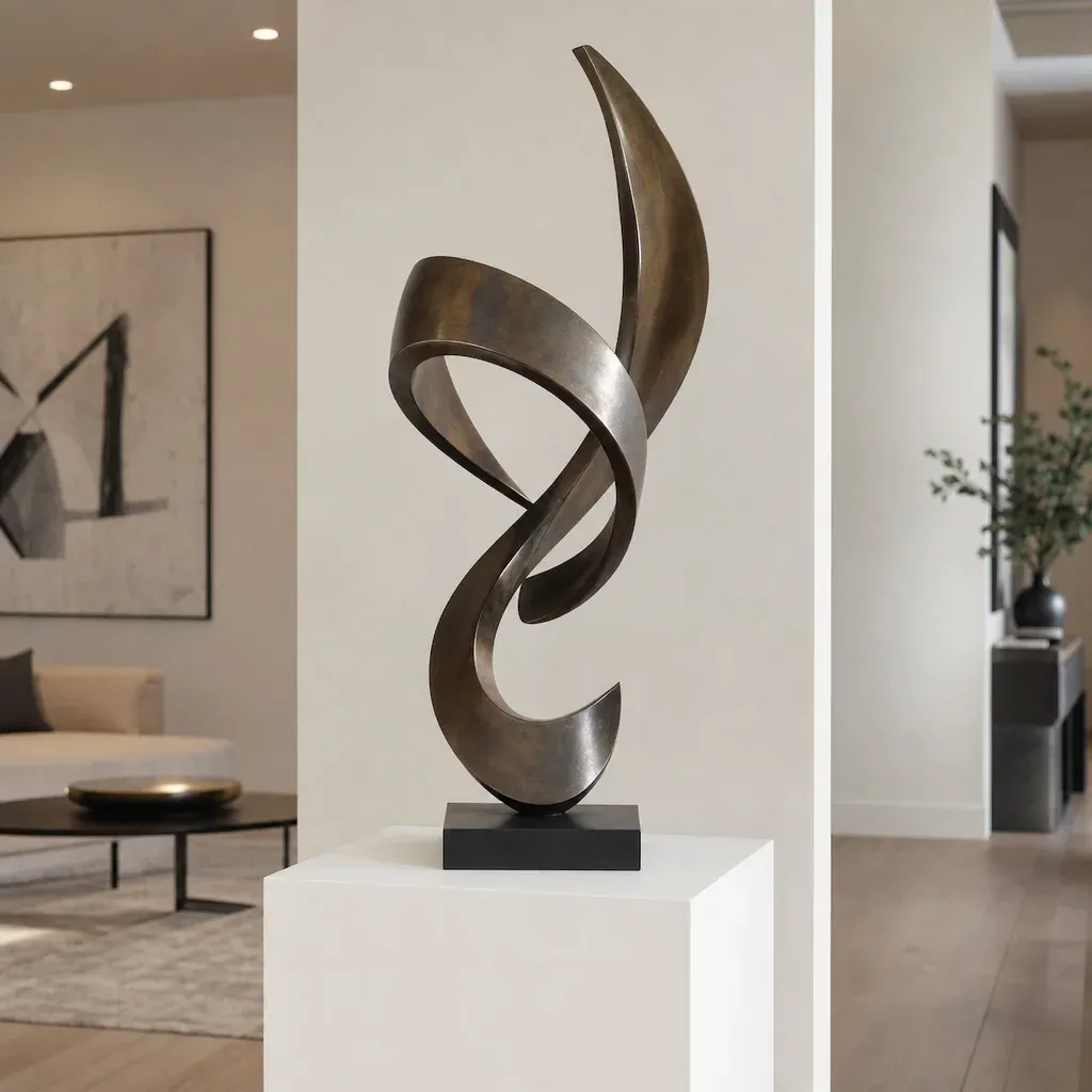 An elegant abstract metal sculpture displayed proudly on a white gallery pedestal in a modern home
